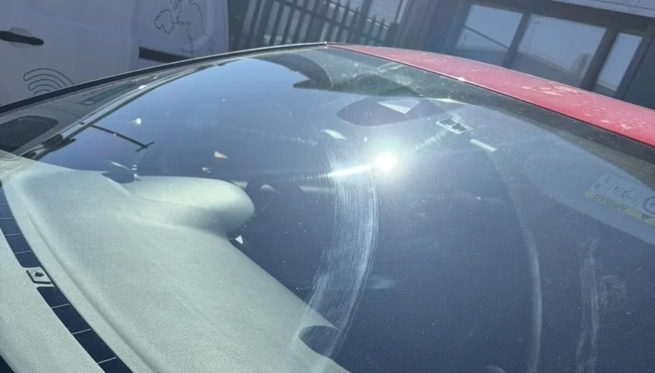 Windscreen wiper scratch damage before polishing restoration